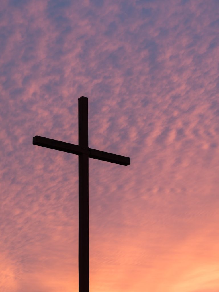 silhouette of large cross during daytime